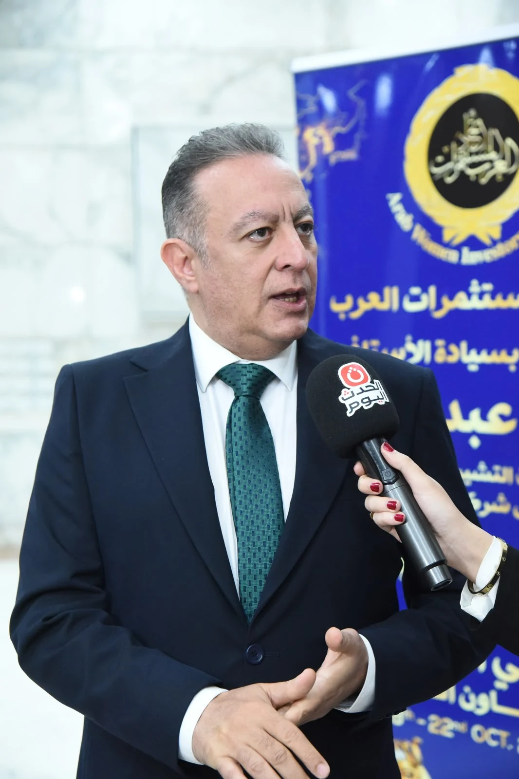 Prof. Dr. Ayman Diab speaking to media correspondents at the Arab Women Investors Union summit forum